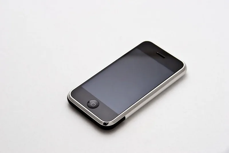 The original 2007 iPhone resting on a plain white surface