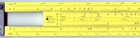 Close-up of a yellow Pickett log-log slide rule, its scales and unit markings printed directly alongside the numbers.