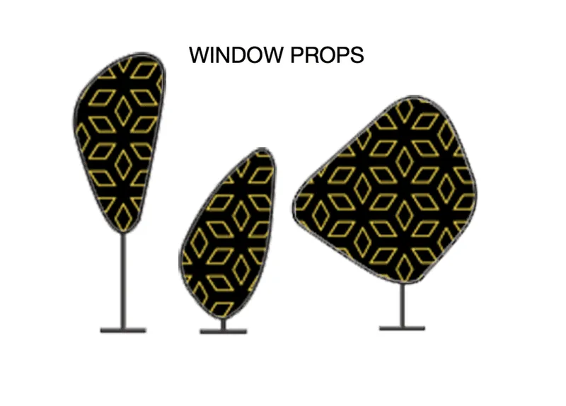 Three freestanding window props with gold geometric patterns on black