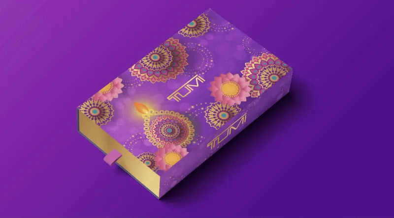 Early packaging concept with gold circular motifs on a purple sleeve