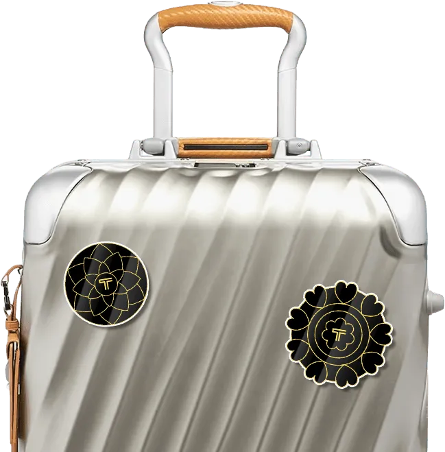 TUMI Diwali sticker medallions on suitcase