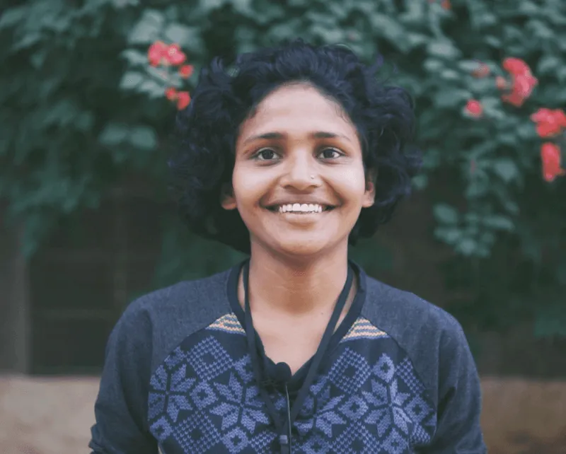 Fellow interview portrait: a smiling woman outdoors